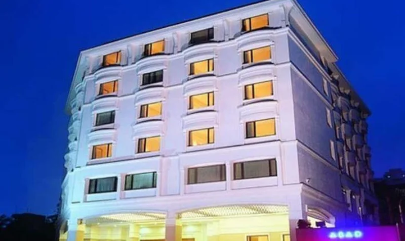 ABAD Atrium neon cursive signage and entrance portal