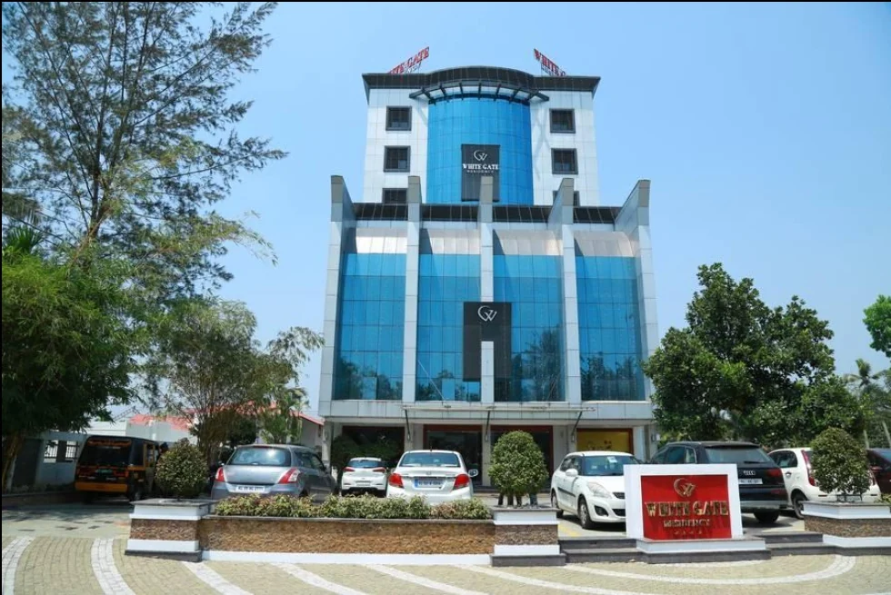 Exterior facade and entrance of Whitegate Residency in Kumarakom