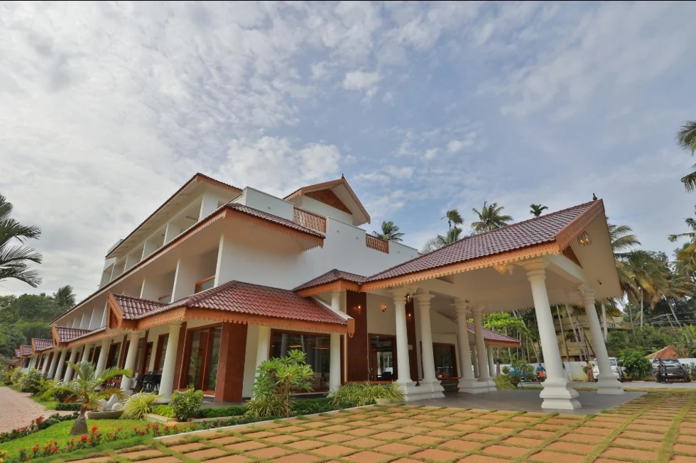 Exterior facade and entrance of Leela Backwaters Inn in Poovar