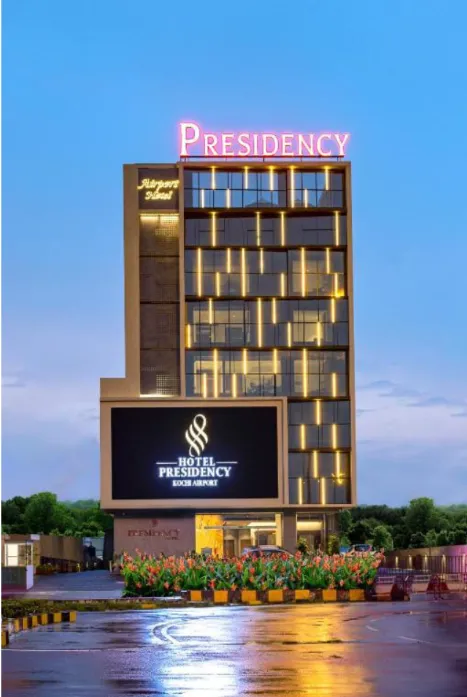Hotel Presidency illuminated vertical pillar sign and entrance