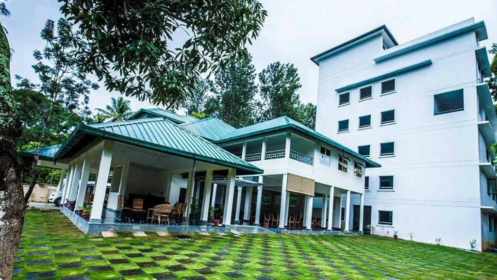 Exterior facade and entrance of Peppervine Hotel in Thekkady